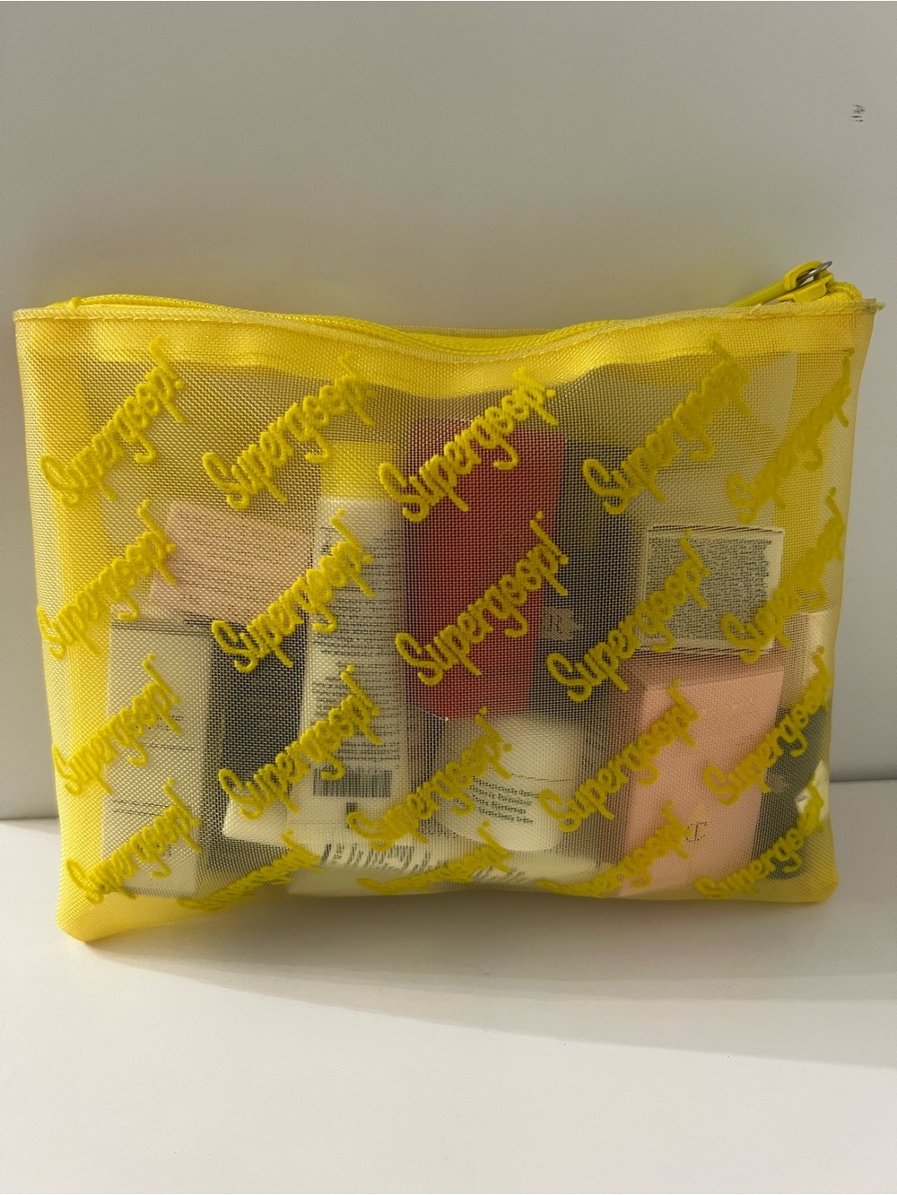 Supergoop! New Yellow Mesh Travel Pouch with mini skin care fsamples bundle. - Picture 2 of 8